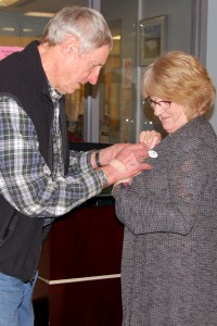 Grateful patient pins caregiver