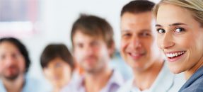 Smiling patients standing in a row