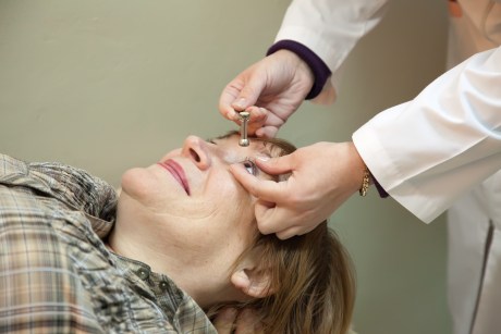 Ophthalmologist measures the ocular tension